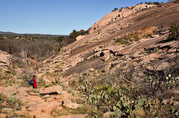 Karen hiking the  Echo Canyon Trail at Enchanted Rock State Natu