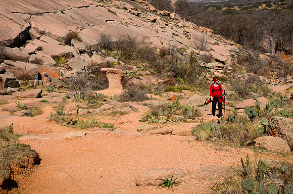 Karen hiking the  Echo Canyon Trail at Enchanted Rock State Natu