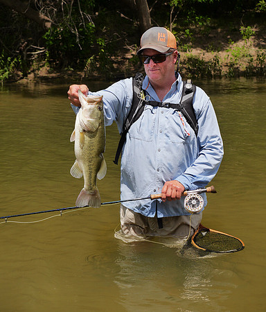 Fly Angler with Largemouth Bass Brazos River Texas