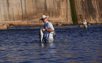 Fly Angler with Striper below Possum Kingdom Dam