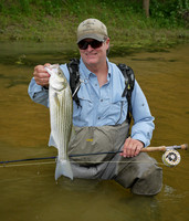 Craig Rucker with Nolan River Striper