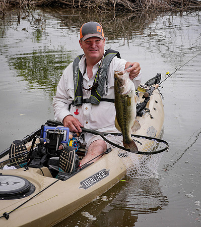 Kayak Fly Angler with Largemouth Bass Brazos River TexasFly