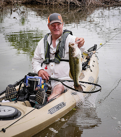 Kayak Fly Angler with Largemouth Bass Brazos River TexasFly