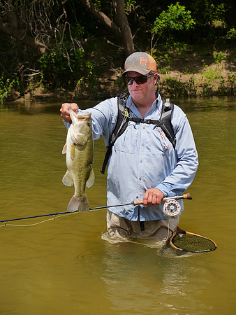 Fly Angler with Largemouth Bass Brazos River Texas